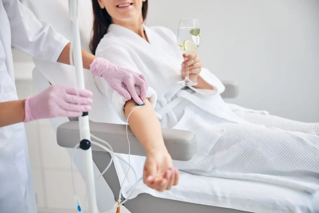 smiling-female-patient-undergoing-intravenous-vita-TTNPP5W-scaled-1920w (1)